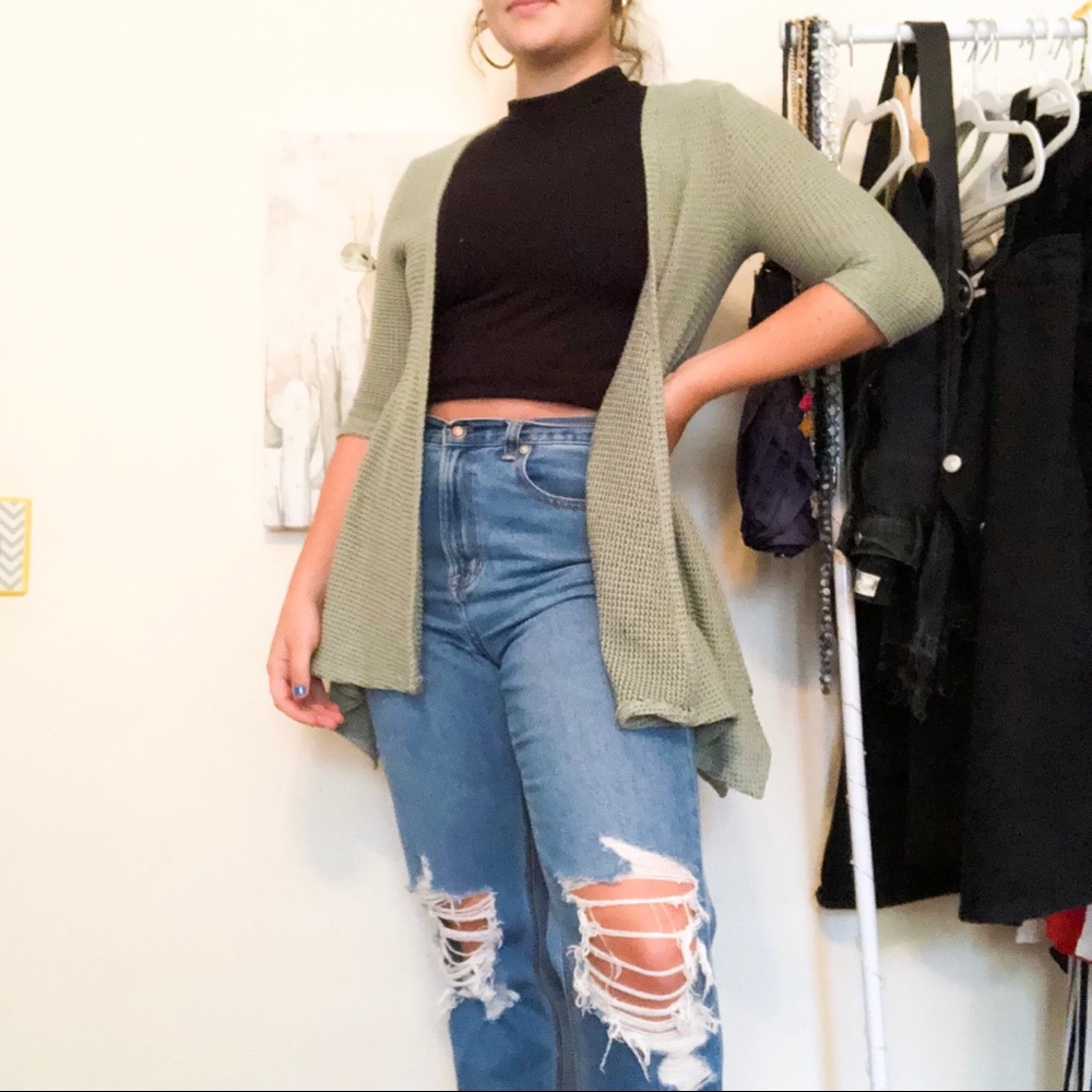 Francesca’s light green cardigan